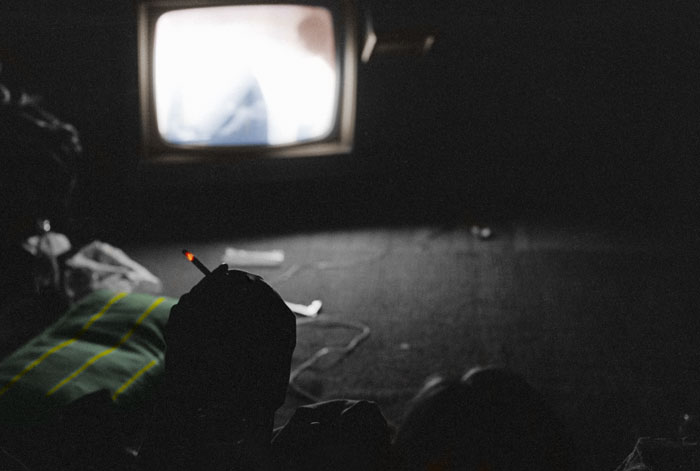 Cigarette in the TV room (tinted monochrome)