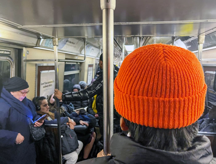 Orange cap on the A train